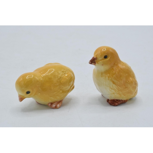 56 - Beswick animals to include chick pecking 2201, seated 2202 and comical pigs 2103 (one chick damaged)... 