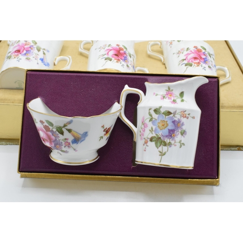 86 - A Royal Crown Derby boxed Posies pattern coffee service, comprising of six cups and saucers, in the ... 