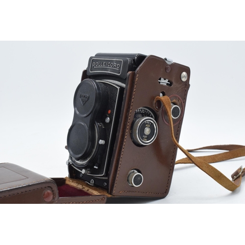 278 - Rolleicord Rollei-Werke camera in brown leather carry case and lens caps.