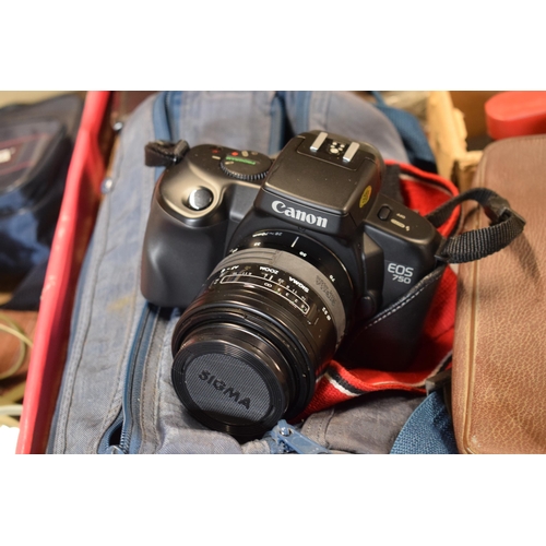 280 - A mixed collection of cameras and accessories to include Canon EOS 750 camera with cover, cary bag a... 