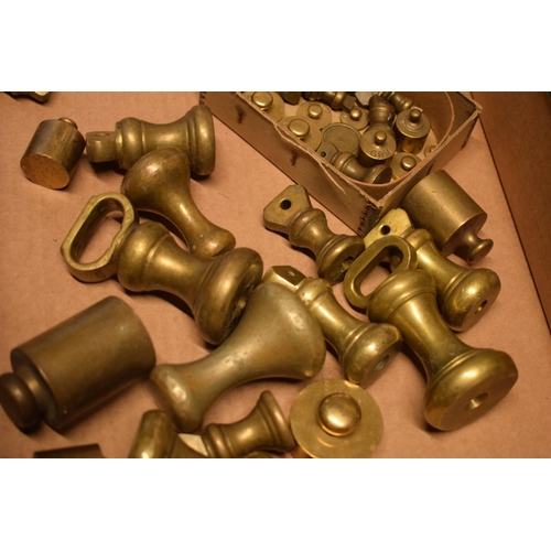 292 - A collection of brass weights of varying forms and sizes.