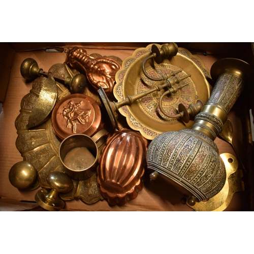 294 - A collection of metalware to include brass and copper items such as jelly mould, brass trays, Easter... 