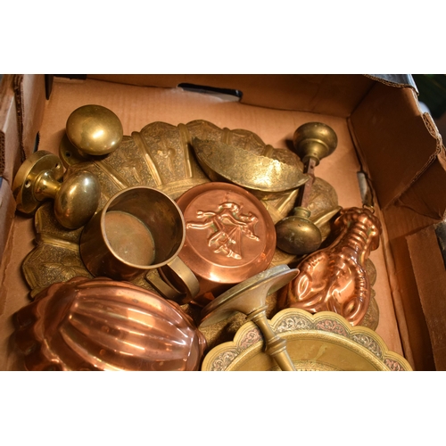 294 - A collection of metalware to include brass and copper items such as jelly mould, brass trays, Easter... 