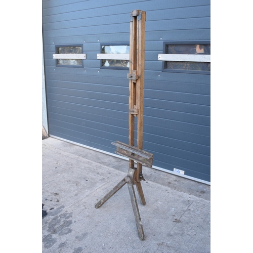 304 - Early 20th century folding artist's easel with heavy duty wingnut and remnants of paint, 190cm tall ... 