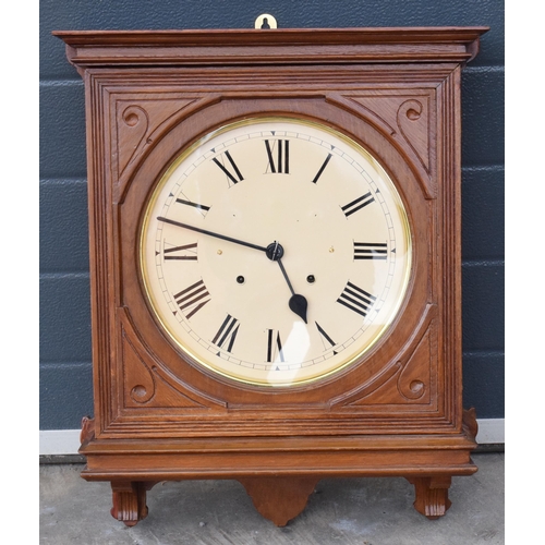 312 - 20th century wooden cased wall clock, in the style of Seth Thomas, with key and pendulum. 58cm long.