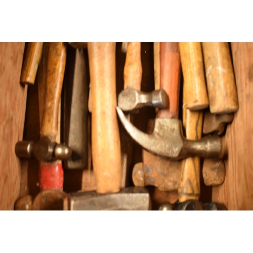 322 - A collection of vintage hammers with wooden handles of varying forms and sizes (Qty).