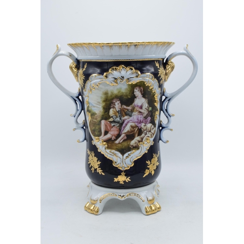 85G - A large Retier pottery double-handled pottery with romantical scenes with gilt decoration, 32.5cm ta... 