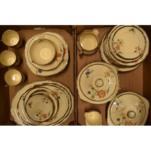 209 - A collection of Alfred Meakin tea ware in the Sunburt pattern to include plates, tureens, cups, sauc... 