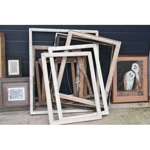 396 - A large collection of wooden picture / painting frames of varying styles, wood types and sizes toget... 