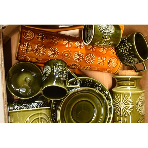 200A - A collection of Portmeirion pottery in the Totem pattern in varying colours and forms to include lar... 