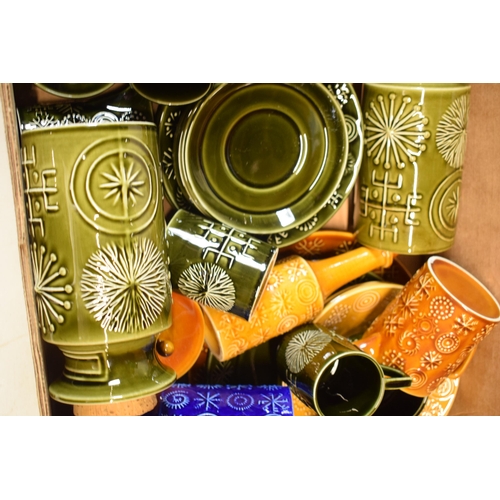 200A - A collection of Portmeirion pottery in the Totem pattern in varying colours and forms to include lar... 