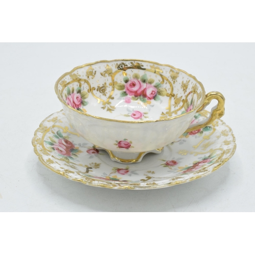 207 - 20th century porcelain floral cup and saucer decorated with roses and foliage (2).