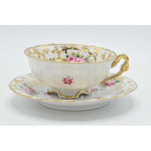 207 - 20th century porcelain floral cup and saucer decorated with roses and foliage (2).