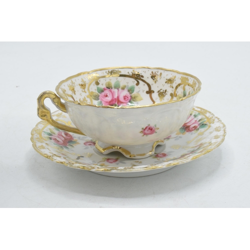 207 - 20th century porcelain floral cup and saucer decorated with roses and foliage (2).