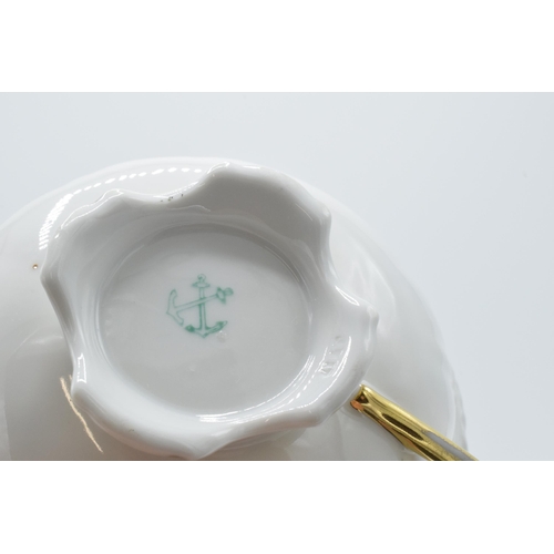 207 - 20th century porcelain floral cup and saucer decorated with roses and foliage (2).