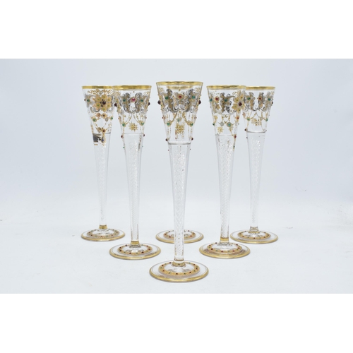 210 - A set of 6 tall glass champagne flutes with swirl, gilt and stone-like decoration (6), 24cm tall.