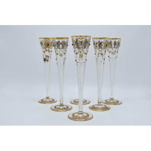 210 - A set of 6 tall glass champagne flutes with swirl, gilt and stone-like decoration (6), 24cm tall.