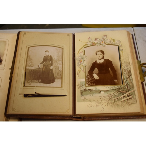 217 - Antique books to include leather bound photo albums to include photos, postcards, Carte De Visites a... 