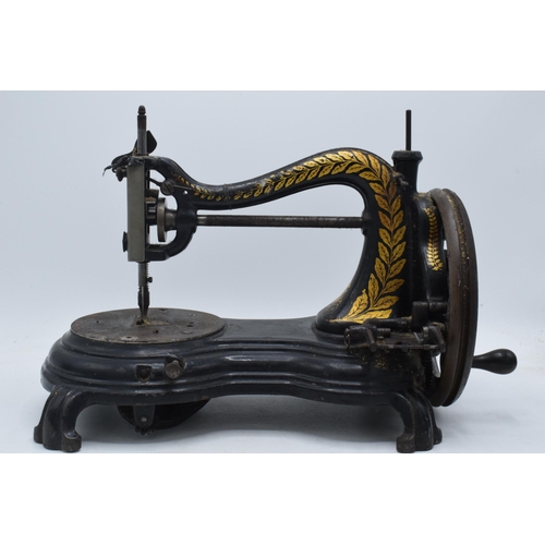 245 - Antique hand-propelled Jones & Company hand sewing machine, 38cm long.