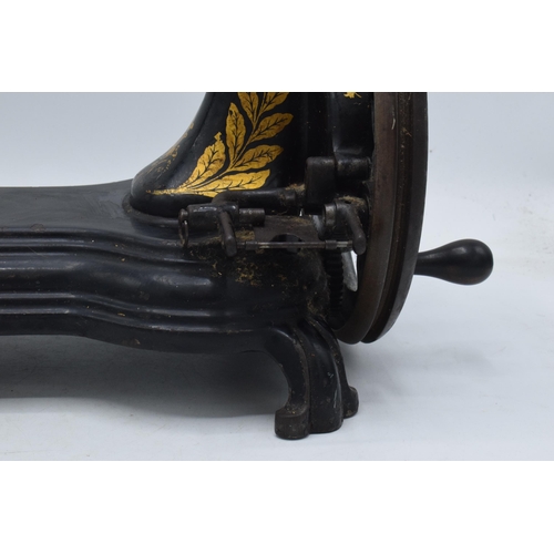 245 - Antique hand-propelled Jones & Company hand sewing machine, 38cm long.