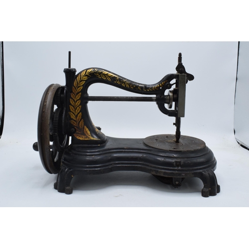 245 - Antique hand-propelled Jones & Company hand sewing machine, 38cm long.