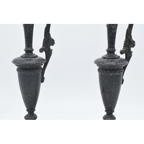 259 - A pair of attractive spelter vases with figural handles on slate bases (2), 31cm tall.