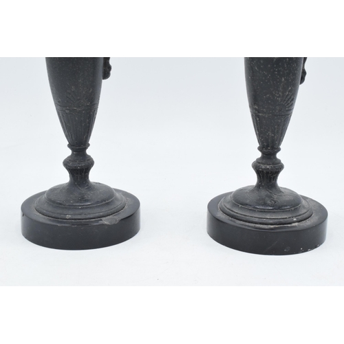 259 - A pair of attractive spelter vases with figural handles on slate bases (2), 31cm tall.