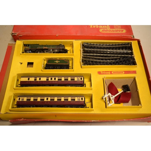 276 - Boxed Triang Electric Model Railway to include train, carriages, track and power unit, untested.