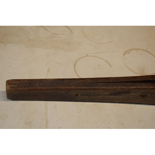 347 - Antique wooden leather saddle stitching tool, 76cm long.