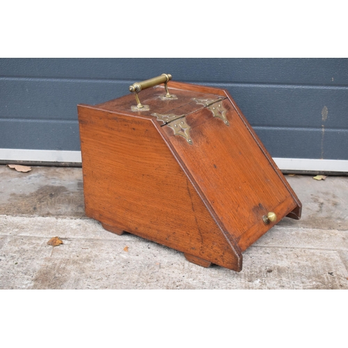 382 - 19th century wooden and brass coal scuttle, 44cm long.