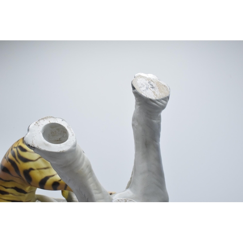 85L - A large Italian ceramic figure of an elephant and tiger by Ronzan, 29cm tall.