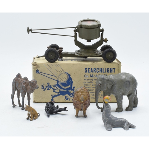 305A - A boxed Britains searchlight on mobile chassis together with similar lead toys to include articulate... 