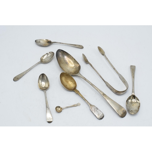105 - A collection of hallmarked silver flatware to include sugar tongues, Georgian and later spoons, 172.... 