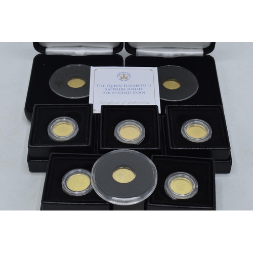 11 - 9ct gold coins: a collection of 8 1.0 grams 9ct gold coins to include Queen Elizabeth II Sapphire Ju... 