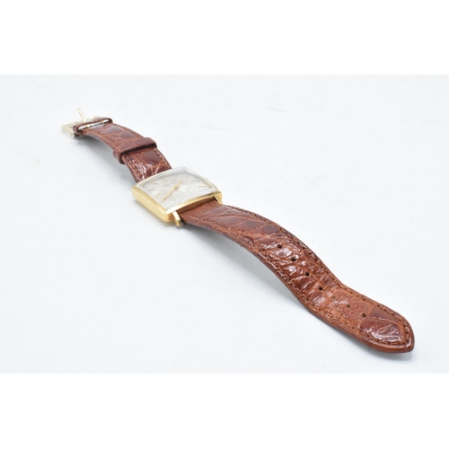 122 - Jaeger 18ct gold automatic wristwatch on leather strap, 30mm wide, 'B.U.O. 1953-1970 102392' to reve... 