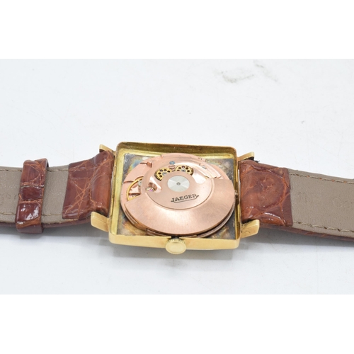 122 - Jaeger 18ct gold automatic wristwatch on leather strap, 30mm wide, 'B.U.O. 1953-1970 102392' to reve... 