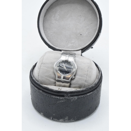 129 - Boxed Tag Heuer steel wristwatch with black dial, with box and papers, in working order.