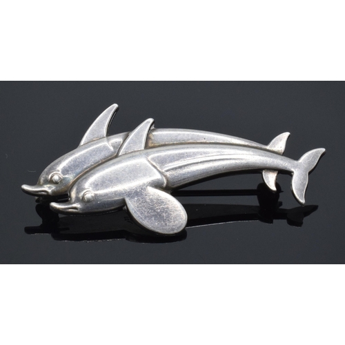 163 - A sterling silver dolphin 'Hawaii' brooch by Georg Jensen, number 317 with marks to the rear. 4cm wi... 