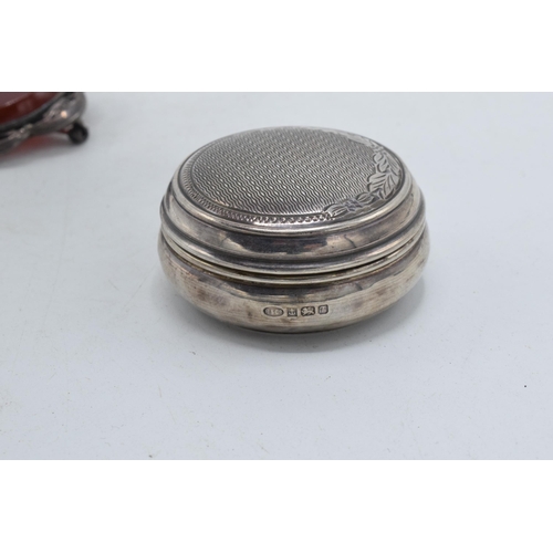 167 - Hallmarked silver pill box with engineered decoration, Birmingham 1993 and a large silver mounted ag... 