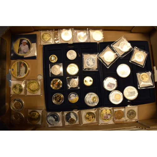 17 - A collection of gold and silver plated commemorative coins of varying forms and sizes (approx 35).
