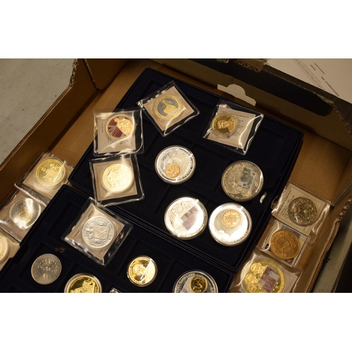17 - A collection of gold and silver plated commemorative coins of varying forms and sizes (approx 35).