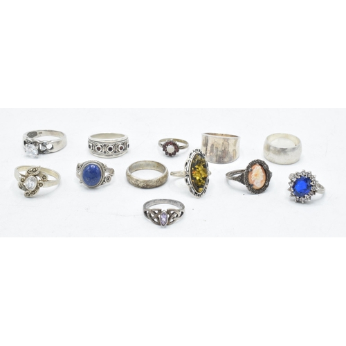 173 - A collection of 12 silver rings of varying forms and sizes, 52.6 grams (12).