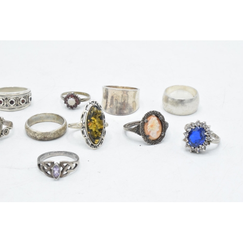 173 - A collection of 12 silver rings of varying forms and sizes, 52.6 grams (12).