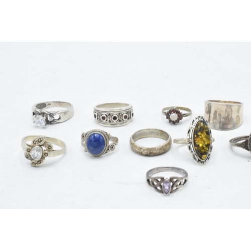 173 - A collection of 12 silver rings of varying forms and sizes, 52.6 grams (12).