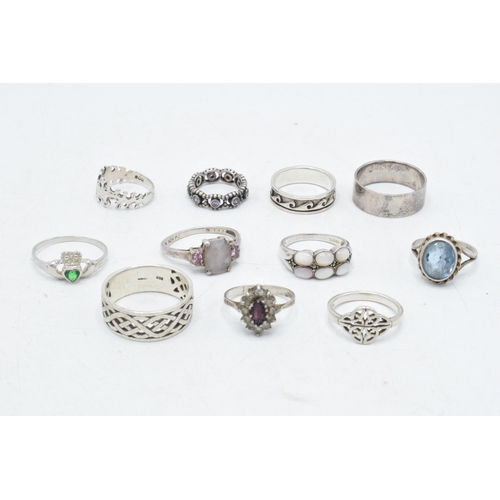 174 - A collection of 11 silver rings of varying forms and sizes, 42.2 grams (11).