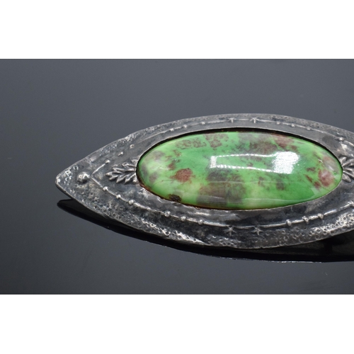 178 - Art Nouveau pewter / silver fonted eye-shaped brooch with Ruskin-style cabachon insert, 8cm wide.