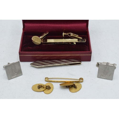 179 - Boxed H Samuel cufflinks and tie clip set together with similar items.