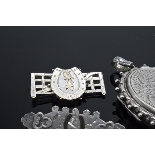 182 - Large silver locket together with 2 horse-themed Victorian silver sweetheart brooches (3).