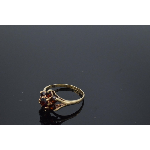 200 - 9ct gold ladies garnet ring, 1.9 grams, size O.