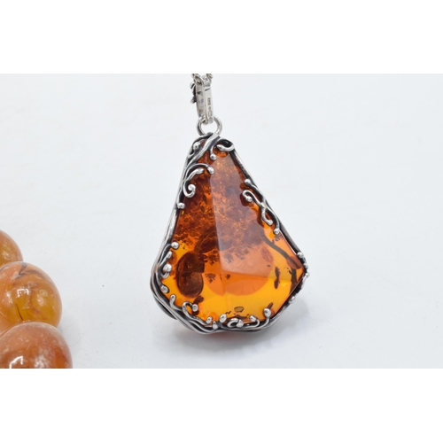 208 - A butterscotch amber (or similar) single-row necklace of graduating amber beads, approximately 37cm ... 